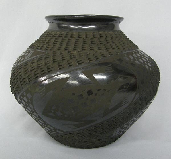 Mata Ortiz Black Textured Pottery by Mario Olivas: Mata Ortiz Black Textured Pottery by Mario Olivas. Measures 7''x8''. SHI $25.