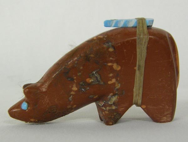 Zuni Pipestone Bear Fetish: Zuni Pipestone Bear Fetish, measures approx. 2.5"L x 1.5"T. Bear has power pack with turquoise arrowhead and he has turquoise eyes. Signed on the bottom. SHI $15.