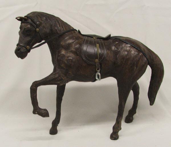 Leather Horse Statue: Leather Horse Statue, measures approx. 11'' x 12.5''. SHI $25.
