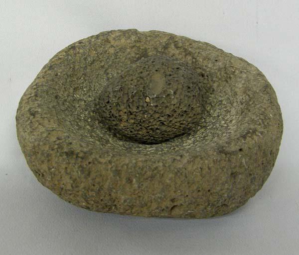 Mimbres Prehistoric Stone Bowl and Small Mano: Mimbres Prehistoric Stone Bowl and Small Mano, bowl measures approx. 2'' x 5'' and mano is 2'' in diameter. SHI $15.