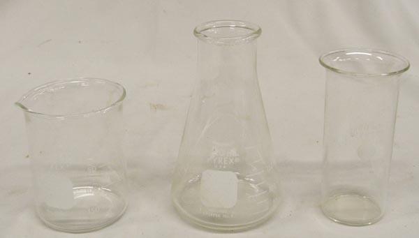Three Pyrex Beakers: Three Pyrex Beakers, includes 200ml, 180 ml, and 250 ml, largest measures approx. 5.25'' x 3.25''. SHI $25.