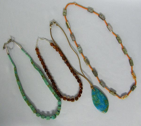 3 Southwestern Pueblo Necklaces Plus: 4 Western Necklaces, 1 turquoise, 1 abalone and orange heishi, 1 amber bead, and 1 chrysocolla pendant strung on leather, longest measures 28''. SHI $15.