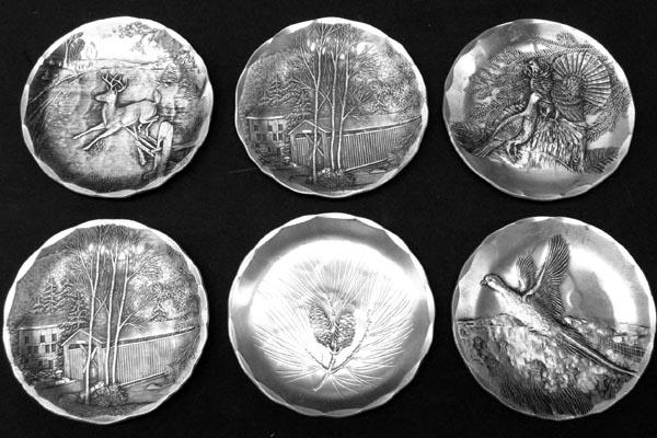 6 Wendel August Forged Grove City PA Pewter Plates: 6 Wendel August Forged Grove City PA Pewter Plates, pictures on plates include: buck, covered bridge, grouses, pheasant, pine cone, and another covered bridge, measures approx. 3.5''. SHI $15.
