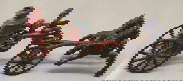 Antique Cast Iron Fire Engine Wagon: Antique Cast Iron Fire Engine Wagon, measures approx. 3 1/2''H x 9''L x 2''W. SHI $20.