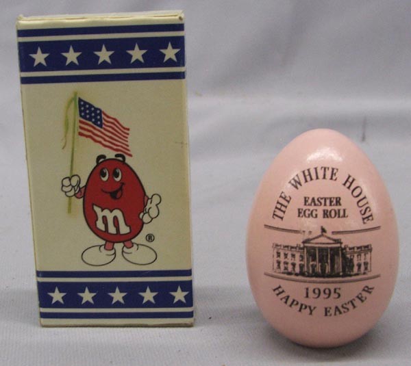 President Clinton Memorabilia - Easter Egg & Candy: President Clinton Memorabilia - Easter Egg & Candy. A wooden Easter egg signed by Bill & Hillary Clinton, 1995. Also a box of M&M Peanut candies signed Bill Clinton and with the seal of the President 