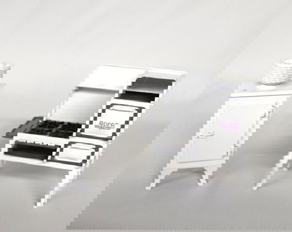 2 Cast Iron Enamelware Doll House Cook Stove & Refrig.: 2 Enameled Metal Doll House Cook Stove and Refrigerator. Designed by Jacqueline Kerr Deiber, Dee's Delights, Inc. New, in box. Range measures 4.5''x5.5''x2.5''. Refrigerator is 6''x3''x2.5''. SHI $20.