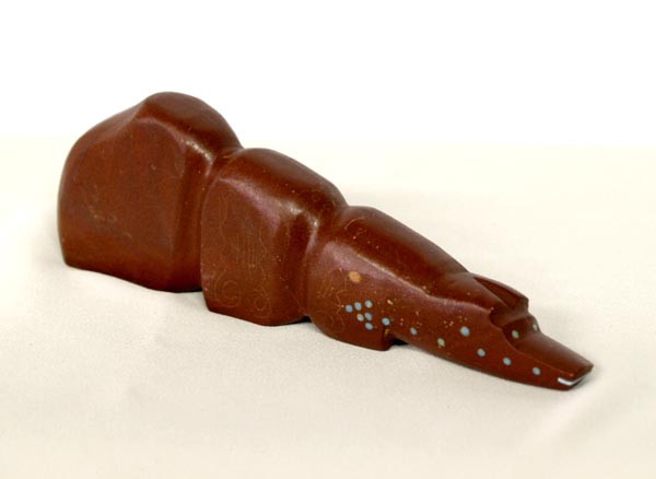 Zuni Pipestone Bear Fetish: Zuni Pipestone Bear Fetish, with turquoise inlay embellishment, measures approx. 5.75'' x .75'' x 2''. SHI $15.