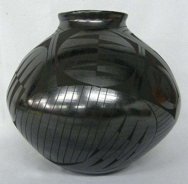 Mata Ortiz Black on Black Jar by Mario Olivas: Mata Ortiz Black on Black Jar Signed by Mario Olivas. Measures 9''Hx9.5''W. SHI $40.