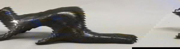 San Ildefonso Pottery Dinosaur by Alfred Aguilar: San Ildefonso Pottery Dinosaur Signed by Alfred Aguilar. Measures 2.5''x10.5''. SHI $20.