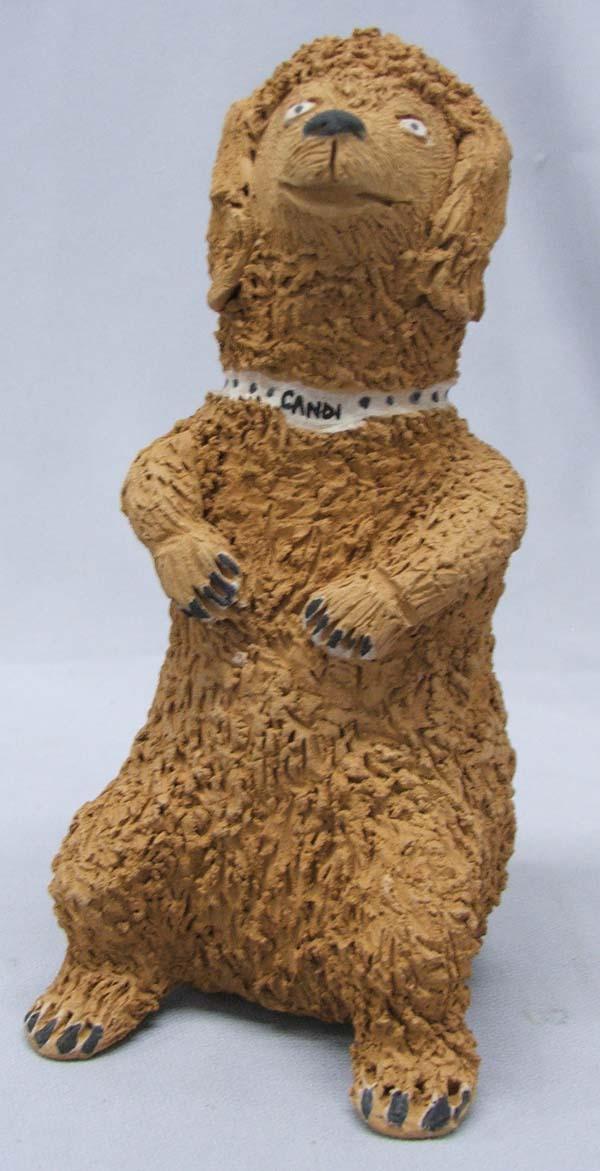 Santa Clara Pottery Dog: Santa Clara Pottery Dog. Dog has collar that says, ''Candi'' and measures 7''Hx4''Dx3.5''W. SHI $20.
