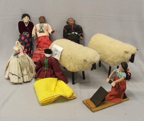 7 Native American & Mexican Dolls and Folk Art: 8 Native American & Mexican Dolls and Folk Art. The smallest doll is the corn cob doll wearing a white dress and measuring 7''. The tallest doll is 12'' and is dressed in yellow and maroon and is from