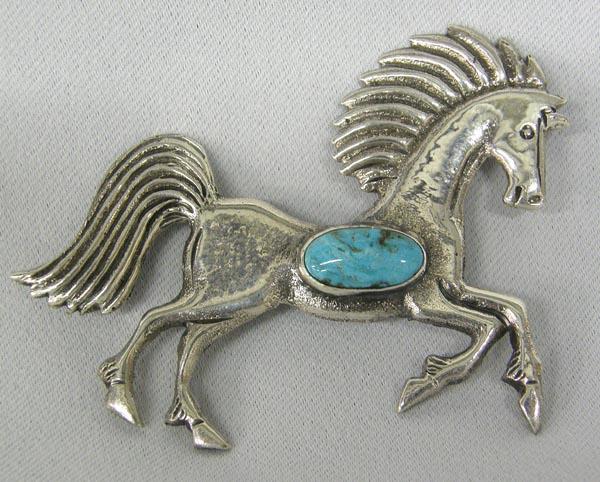 Navajo Silver Turquoise Horse Pin by Clarence Lee: Navajo Silver Turquoise Horse Pin by Clarence Lee. Stamped on back with artist's name, ''sterling'' and a hallmark. Measures 2''Hx2.75''W. SHI $15.