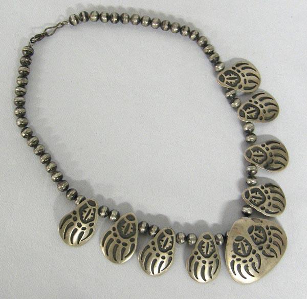 Hopi Silver Overlay Bear Claw Necklace w/Hallmark: Hopi Silver Overlay Bear Claw Necklace w/Hallmark. Measures 17.5'' end to end. Center pendant is 1-5/8''x1-7/8''. SHI 15.