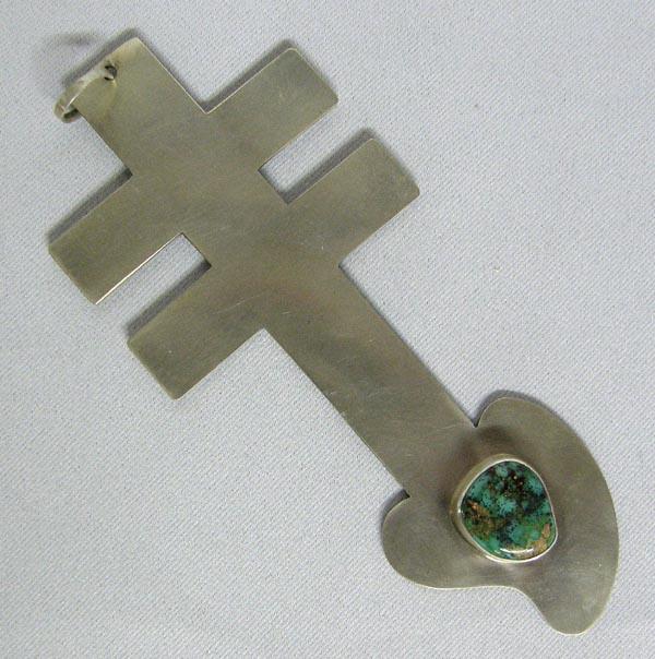 Navajo Pilot Mtn Turquoise Cross Pendant by Begay: Navajo Silver Pilot Mtn Turquoise Cross Pendant. Hallmark on back ''EB'' for Edison Begay. Measures 5''x2.25''. Turquoise cabochon is 3/4''x5/8''. SHI $15.