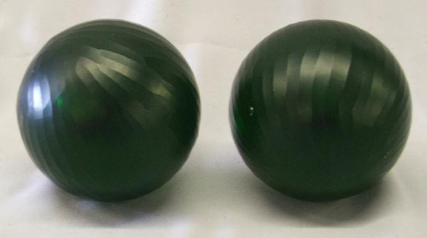 2 Victorian Green Carved Glass Balls: 2 Victorian Green Carved Glass Balls. Measures approx. 12''. SHI $25.