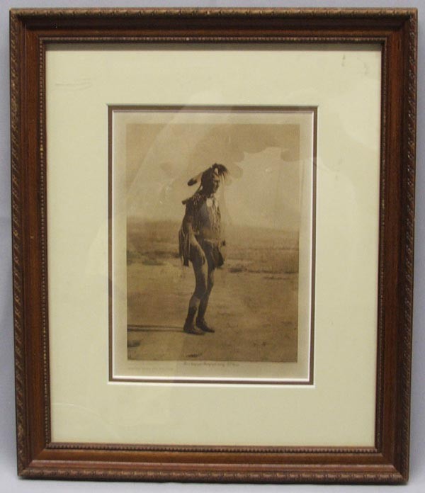 1908 E.S. Curtis Print ''White Man Runs Him'': 1908 E. S. Curtis Photogravure Print of ''White Man Runs Him.'' The Indian in this print was known as ''White Man Runs Him.'' A Mountain Crow of the Big Lodge clan, he led the scouting party for Custe