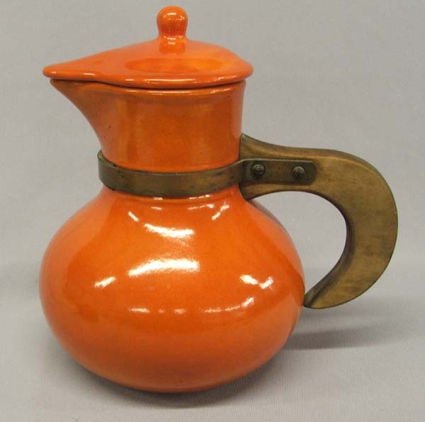 USA Orange Pottery Coffee Pot: USA Coffee Pot. Possibly Bauer/Fiesta. Measures approx. 9''H x 8''W. SHI $25.