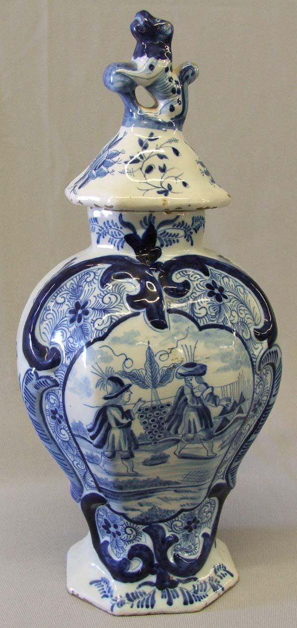 Antique Blue & White Delft Lidded Vase: Antique Blue & White Delft Lidded Vase. Standing Lion finial lid. Lid and vase could be a marriage, as lid is loose on the top of the vase. Measures with the lid approx. 13''H x 5 1/2''W x 4 1/3''D. S