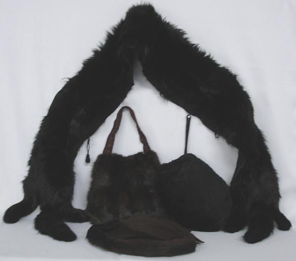 Antique Fur Wrap, 2 Fur Muffs and Fur/Felt Hat: Antique Fur Wrap, 2 Fur Muffs and Fur/Felt Hat. The Black wrap measures 7' from tail end to tail end and has a cloth clasp to join it around the wearer's shoulders. The tag says, ''Popular D.G. Co., E