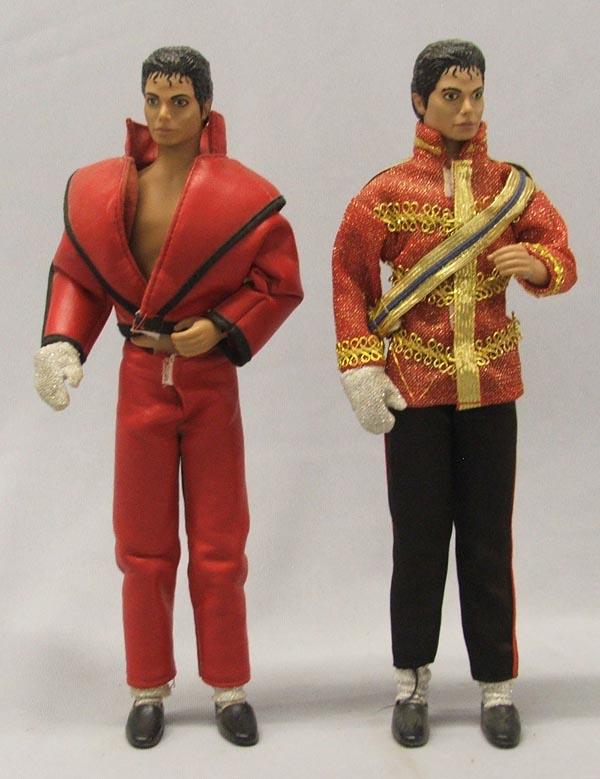 2 Michael Jackson Dolls: 2 Michael Jackson Dolls. One is on a stand. Measure approx. 11 1/2'' tall. SHI $25.