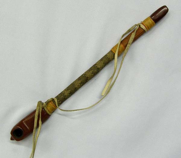 Vintage Pipestone Snakeskin Pipe: Vintage Pipestone Snakeskin Pipe. The Pipe has been used. Measures approx. 17'' Long. SHI $20.