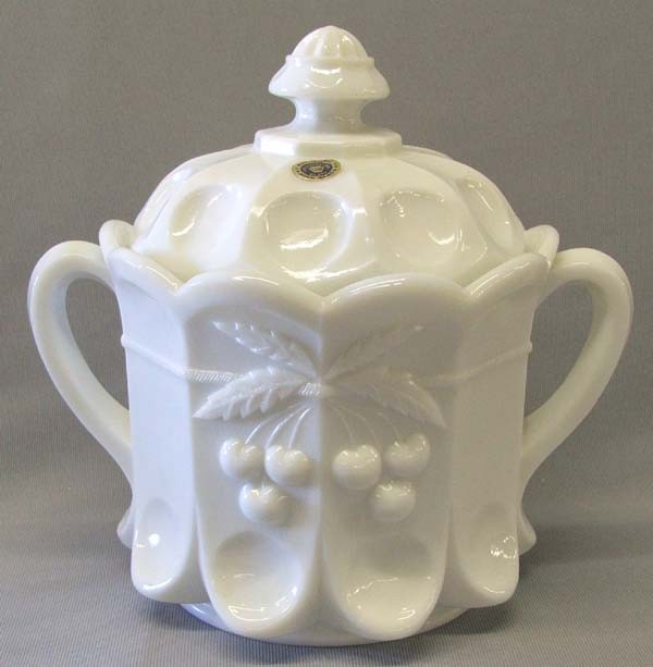 Westmoreland Milk Glass Covered Cookie Jar: Westmoreland Milk Glass Cookie Jar. Has paper label inside and outside. Measures approx. 8''H x 7 1/2''W. SHI $30.