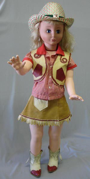 Eugene Cowgirl Doll: Eugene Cowgirl Doll. Has a hat and cowgirl clothes and boots. Measures 32''. SHI $30.