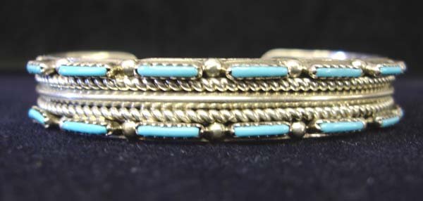 Navajo Silver Needlepoint Turquoise Bracelet: Navajo Sterling Silver Needlepoint Turquoise Bracelet. Measures 6.5" inside and 0.5" wide. Stamped Sterling inside. SHI $15.