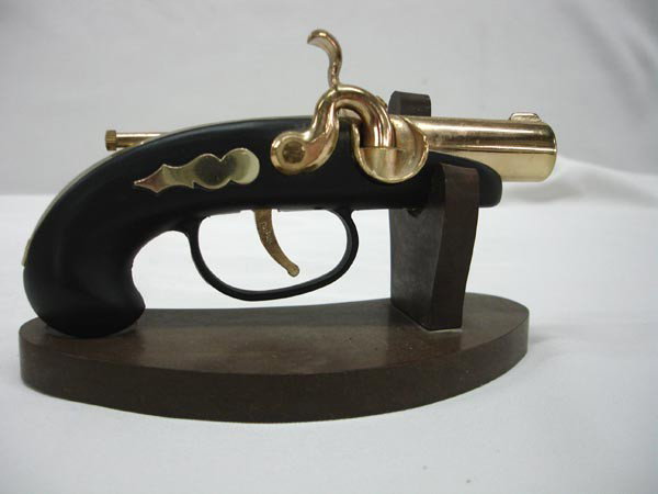1970 Ft Bragg Derringer Pistol Lighter: Vintage Cigarette Lighter Derringer Pistol Shape. Inscribed ''FT BRAGG DET 1970'' on the top. Does Work. Measures 6'' long.