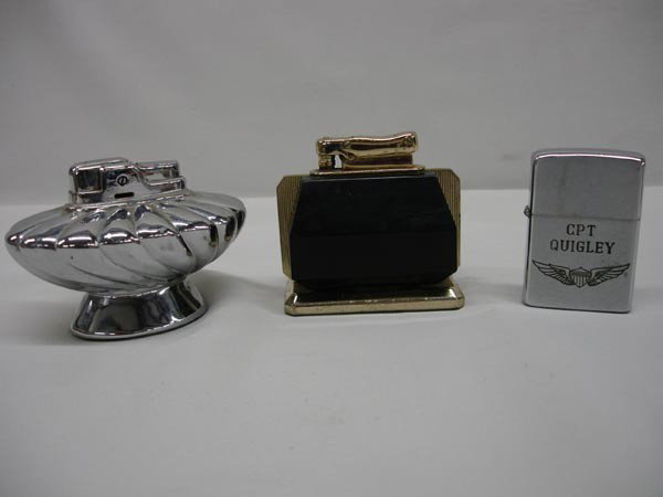 Vintage Cigarette Lighters indluding Vietnam Zippo: 3 Vintage Cigarette Lighters. The Zippo lighter is inscribed: ''CPT QUIGLEY'' on one side and ''UNDERTAKER 'BOSS' VIETNAM 68-69'' on the other side. The black and brass lighter measures 2.75''x2.5''. 