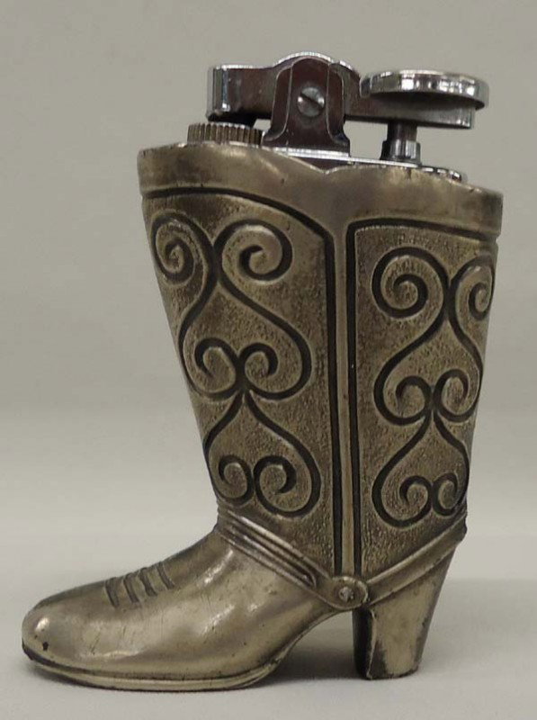 Vintage Japanese Cowboy Boot Lighter: Vintage Metal Cowboy Boot Cigarette Lighter, made in Japan. Measures approx. 3 1/3'' tall. SHI $15.