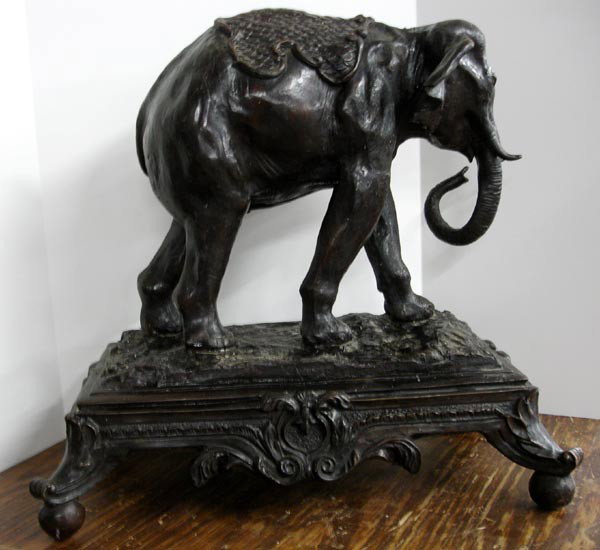 Large Bronze Elephant MUST BE PICKED UP: Large Bronze Elephant MUST BE PICKED UP. The very tip of the tusks are damaged. Measures 22''Hx22''Lx14''D.