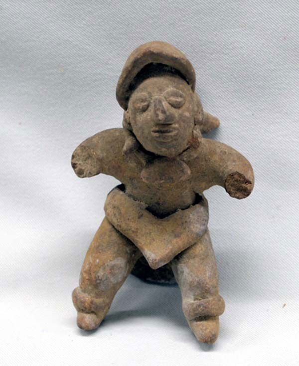 Pre-Columbian Clay Statue: Pre-Columbian Clay Statue. Pieces broken off object on man's back and arms are broken and left ear, as shown in photograph. SHI $20.