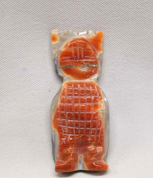 Zuni Red Shell Corn Maiden Fetish: Zuni Corn Maiden Fetish, Spiny Oyster. Inlaid silver eyes. Carved spiny oyster on front and carved MOP on back. Measures 2.25''x1''. SHI $15.