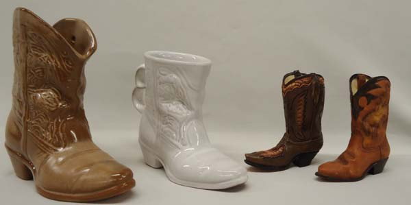 4 Western Ceramic Boots, 2 Frankoma, 2 Composite: 4 Western Boot Statues 2 Frankoma, 2 Composite. The two largest boots are Frankoma. The brown one measures 6-5/8''Hx7.25''Lx2-5/8''W. SHI $25.