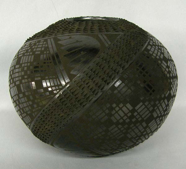 Mata Ortiz Black Textured Geometric Pot by Olivas: Mata Ortiz Black Textured Geometric Pot by Mario Olivas. Measures approx. 5.5''Hx7''W. SHI $30.