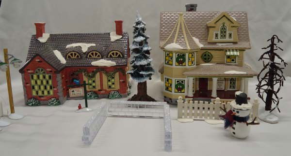 Snow Village Ceramic Houses Plus: Snow Village Ceramic Houses Plus. 2 Ceramic house with lights, largest measures approx. 9''H x 8 1/2''L x 6 1/2''D. 2 trees, snowman, ice crystal walls, street lamps. SHI $60.