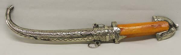 Berber Ornamental Curved Dagger: Berber Ornamental Curved Dagger, Camel bone handle and decorative scabbard. Measures approx. 12''. SHI $20.
