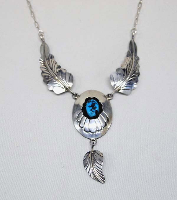 Navajo Sterling Silver Turquoise Necklace: Navajo Sterling Silver Turquoise Necklace, measures approx 14'' end to end with a shadow box pendant 1.5'' x 1''. Small silver dangle off of the pendant. SHI $15.