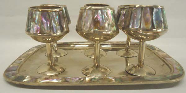 Vintage Mexican Hand Made Cordial Set: Vintage Mexican Hand Made Cordial Set. Silverplate with abalone shell. 6 cordials on tray. Tray measures approx. 7 1/2'' x 5 1/2''. SHI $25.