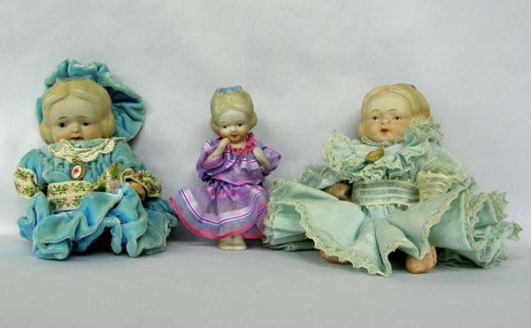 3 Antique Japanese Bisque Dolls: 3 Antique Japanese Bisque Dolls. One doll has no arms & legs. One doll has one arm missing & one damaged. Smallest doll has all limbs. Heads are in good shape. One doll is googly eyed. Vintage clothin