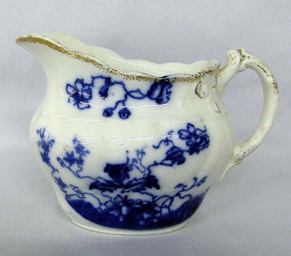 Antique English Flow Blue W.H. Grindley Pitcher: Antique English Flow Blue W.H. Grindley ''Duchess'' Pitcher with Gilding. Measures approx. 4''Hx6''W. SHI $20.