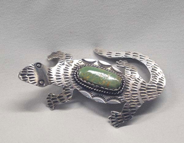 Navajo Silver Turquoise Lizard Pin by Cleveland: Navajo Sterling Silver Green Turquoise Lizard Pin by Albert Cleveland. Measures approx. 1x3.5''. SHI $15