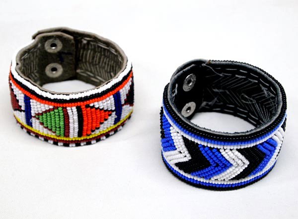 Pair of African Beaded Leather Bracelets: Pair of African Beaded Leather Bracelets. Snap closure. Each measures 6.5''x1-3/8''. SHI $15.