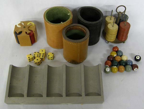 3 Leather Dice Cups, 2 Mini Poker Chips Sets, Plus: 3 Leather Dice Cups, 2 Mini Poker Chips Sets, Plus a Set of Mini Cue Balls and Full Size Metal Poker Chip Rack. Largest dice cup measures approx. 4''Hx3''W. Buyers Pay Actual Shipping and Handling Cha
