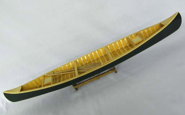 Handmade Model Wooden Canoe on Stand: Model Wooden Canoe on Stand. Measures approx. 27''Lx4.25''W. Buyers Pay Actual Shipping and Handling Charges(see terms and conditions for more information).