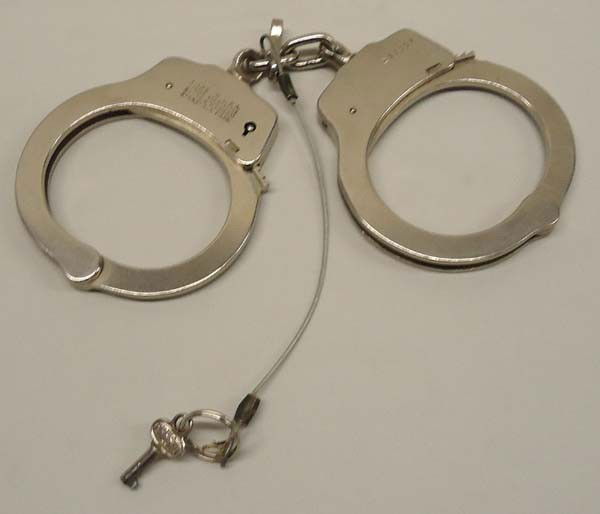 Pair Of Smith & Wesson Handcuffs With Key: Pair Of Smith & Wesson Handcuffs With Key, made in USA, Springfield, MASS. Measure approx. 8 1/2'' end to end. Buyers Pay Actual Shipping and Handling Charges(see terms and conditions for more informa