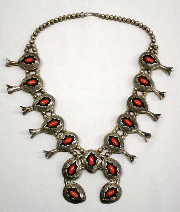 Native American Navajo Squash Blossom Necklace w/Coral: Navajo Squash Blossom Necklace w/Coral w/Hallmark. Hallmark on back of Naja is ''JM'' Necklace measures 23'' end to end. The Naja is 3.25''x 2.75''. The shadow box cabochons outer dimensions are 1.25'
