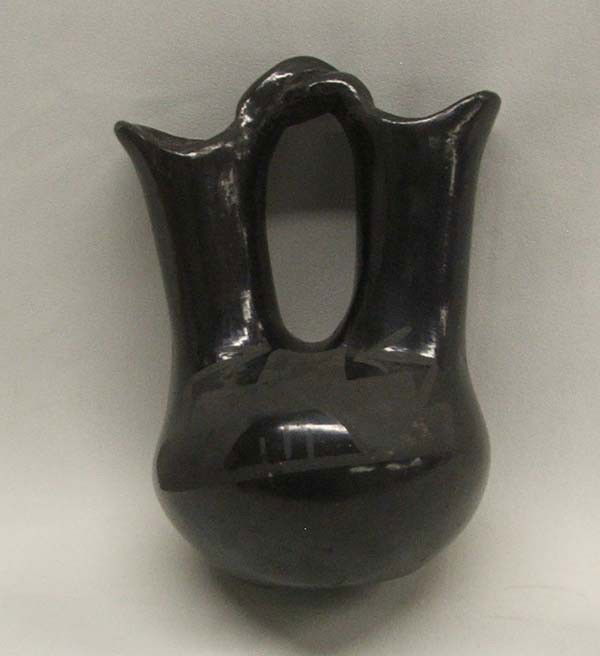Native American San Ildefonso Wedding Vase: San Ildefonso Wedding Vase, measures approx. 6 1/2''H x 3 3/4''W. Buyers Pay Actual Shipping and Handling Charges(see terms and conditions for more information).