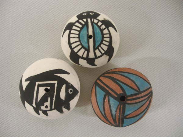 3 Mini Native American Acoma Pottery Seed Jars by Chino: 3 Miniature Acoma Pottery Seed Jars by Chino. All are signed on bottom with Hallmark for Chino. Largest is the fish, 1-3/8'' diameter. Fish, turtle and geometric designs. Buyers Pay Actual Shipping an